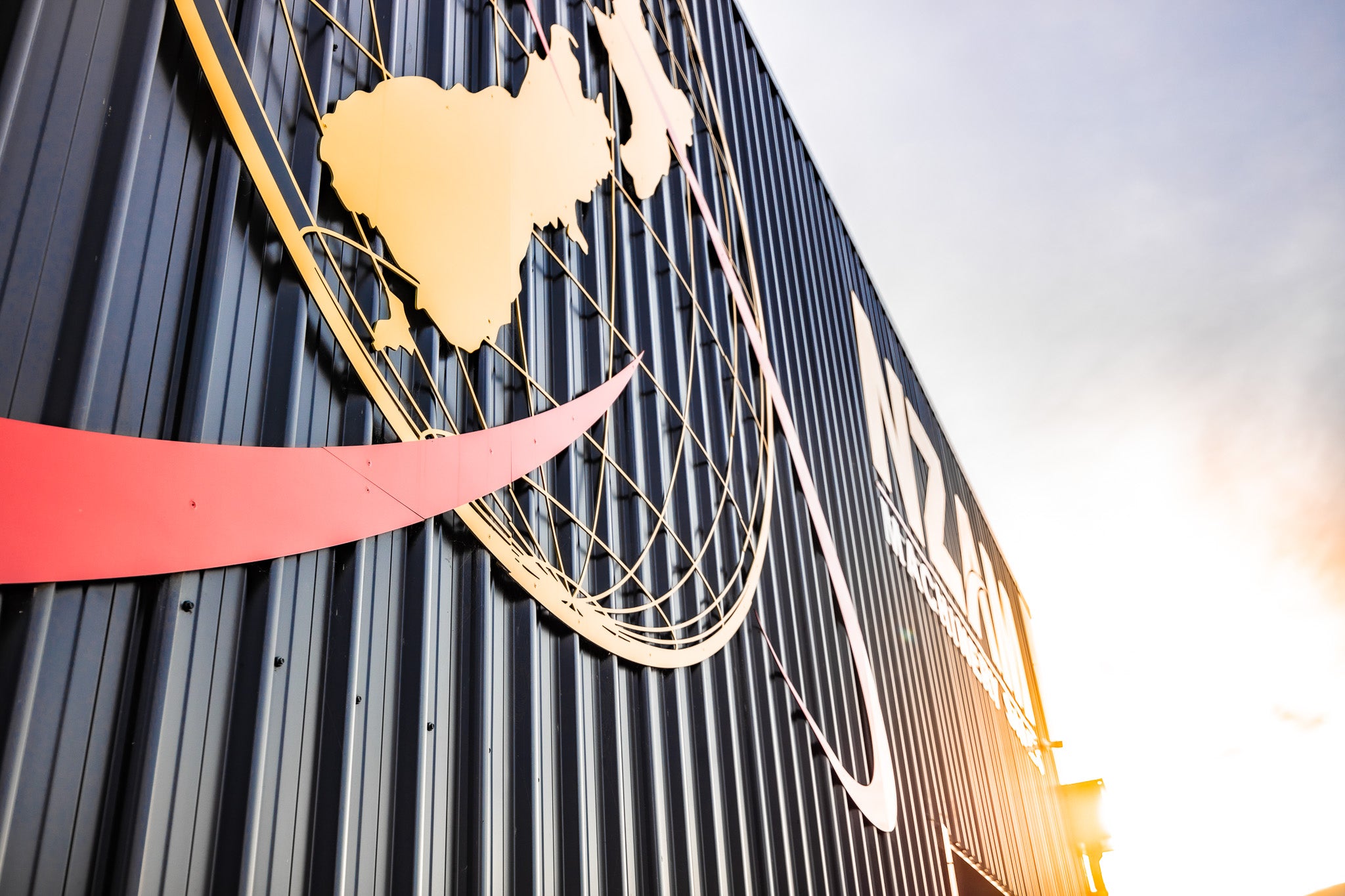 The NZAM Logo during sunset