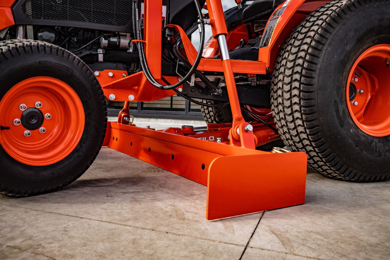 Close up view of straight grader blade in orange