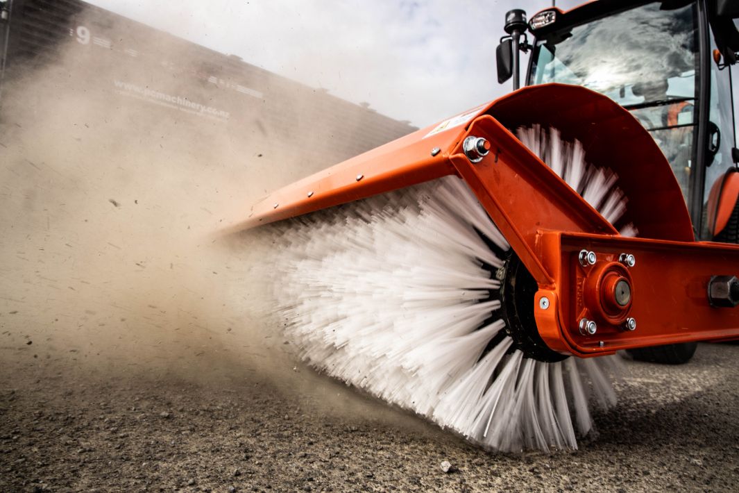 Close-up view of Neilo Broom sweeping a road